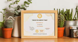 Certificate on a wooden shelf with plants.
