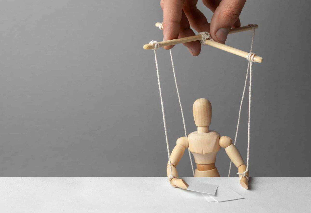 Human Puppet on strings being manipulated