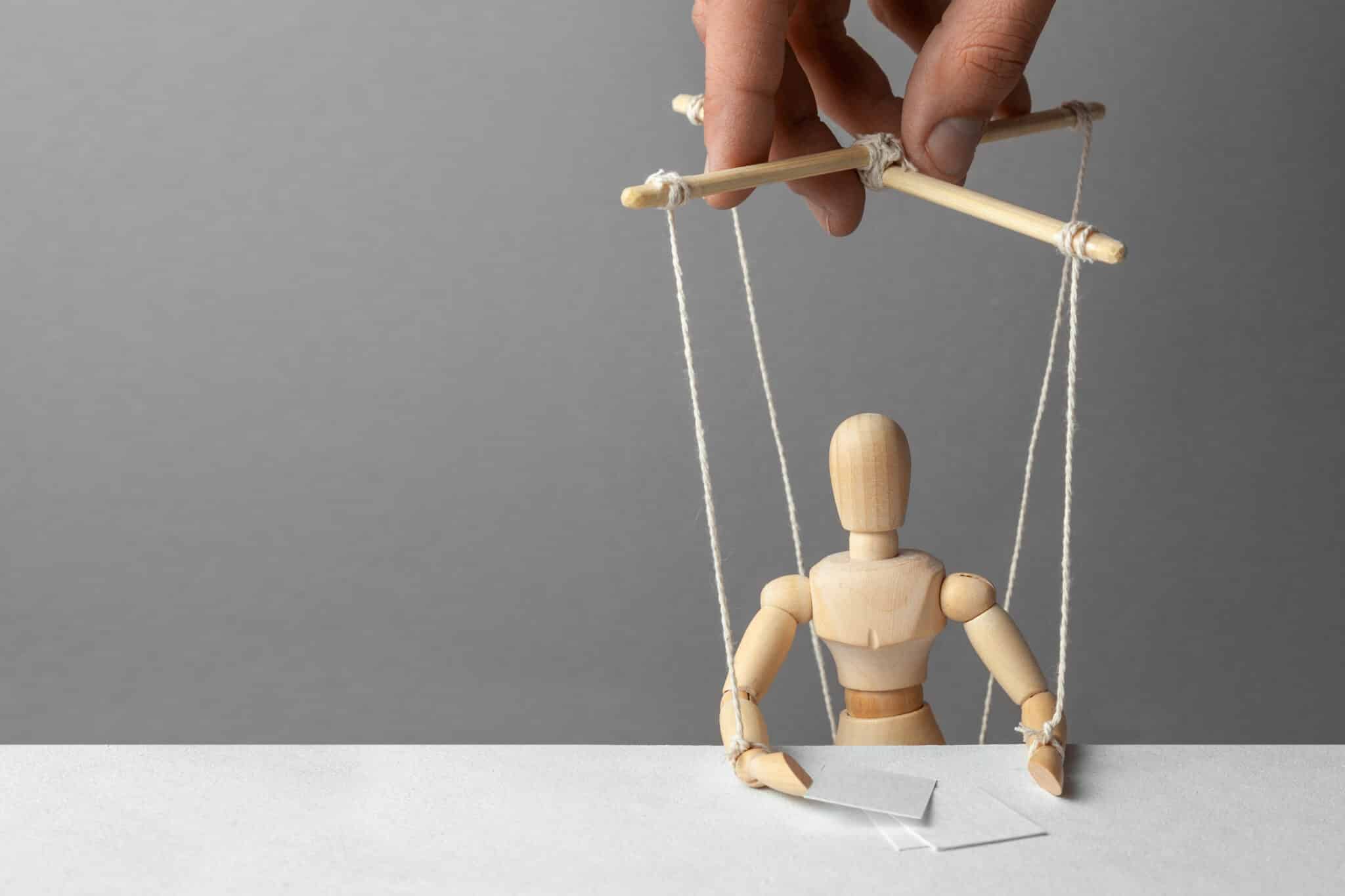 Human Puppet on strings being manipulated
