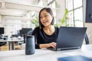 Woman working on laptop in modern office