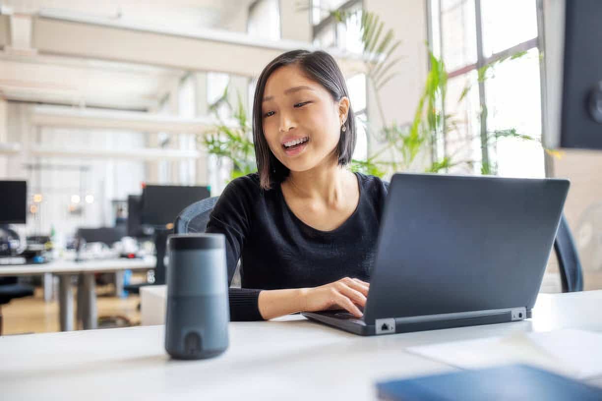 Woman working on laptop in modern office