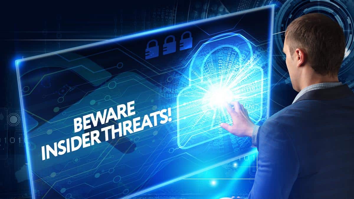 Man interacting with digital security warning screen.