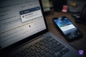 Laptop and smartphone with message notifications displayed.